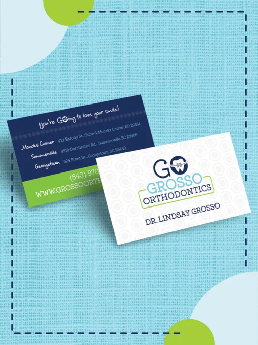 A display of Grosso Orthodontics business cards featuring locations in South Carolina. The cards have a professional and inviting design.