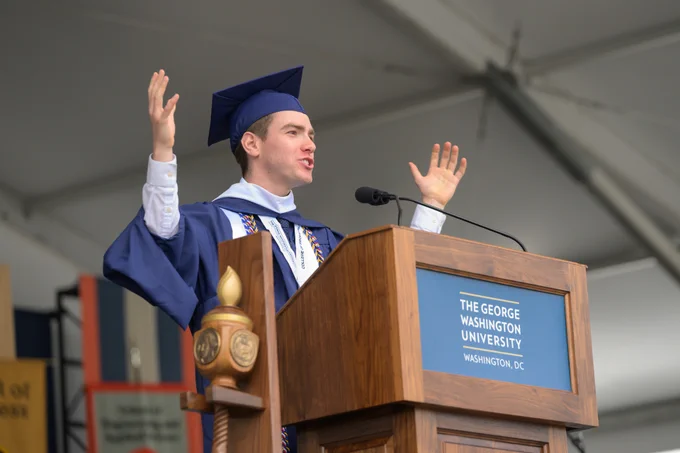 Student speaker Ethan Fitzgerald standing at the podium and speaking during the George Washington University Commencement.