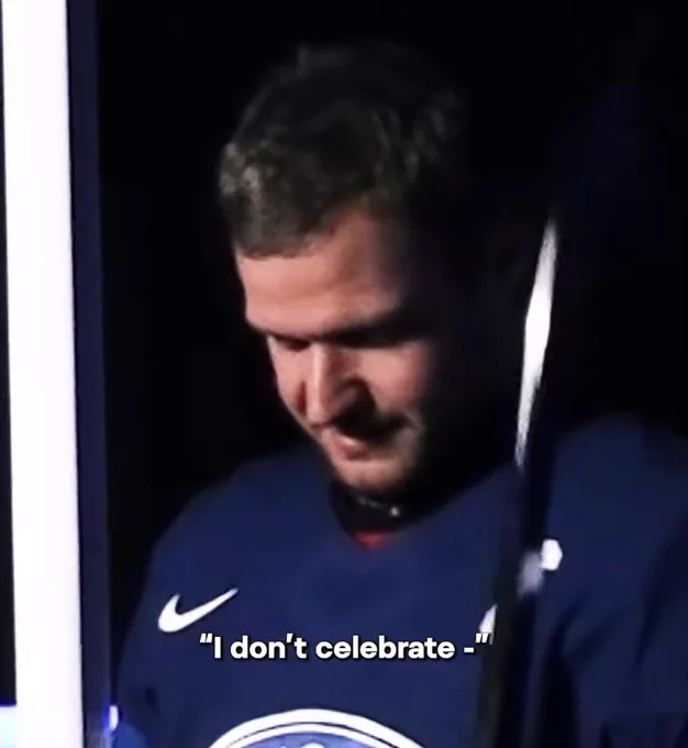 aleksander barkov in team finland jersey looking down, subtitle reads "I don't celebrate"