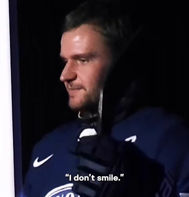 aleksander barkov in team finland jersey looking forwards, subtitle reads "I don't smile"