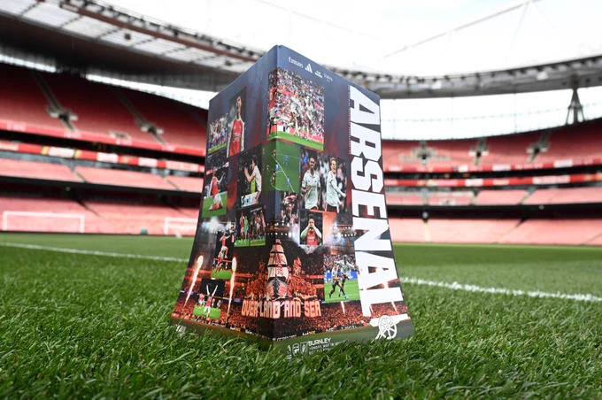 Tonight's programme positioned on the pitch at Emirates Stadium. The double page cover features highlights from what's been a memorable season