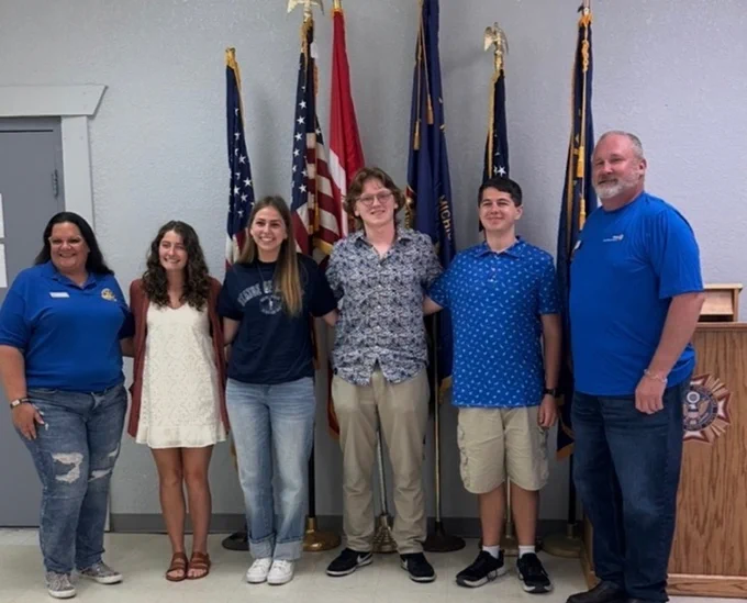 4 students and 2 rotary members in the picture 