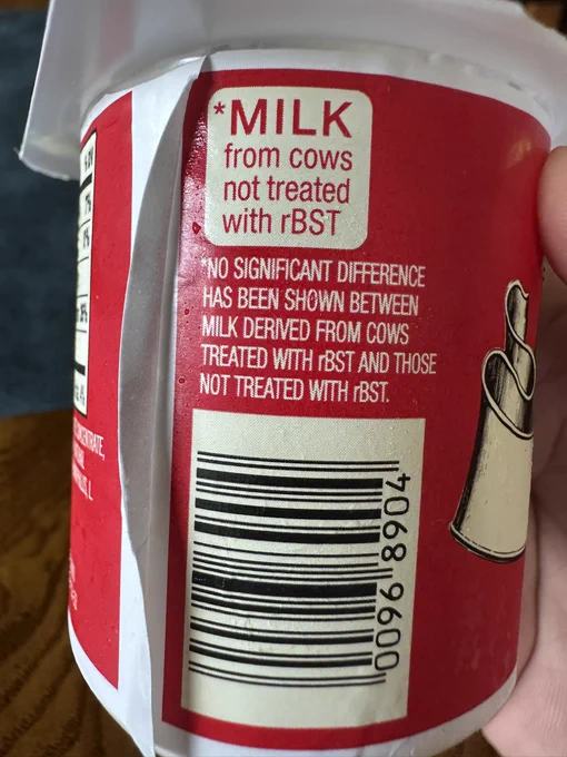 Photo of a yogurt box from Trader Joe’s.  Label says “milk from cows not treated with rBST” and then there’s a footnote beneath it that says “no significant difference has been shown from cows milk treated with rBSR and those not treated with rBST.”