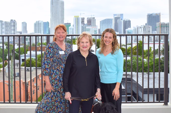 (Photo) Carol Brady-Simmons, Virginia Jacko, and Dr. Hannah Crop, smiling for the camera while standing outside at Miami Lighthouse for the Blind.