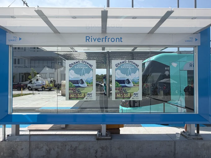 Streetcar stop for the Riverfront, with arrows pointing south labeled "UMKC"