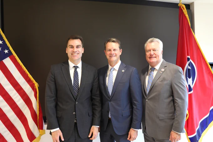 Photo featuring from L to R: Under Secretary William Kimmitt, Stuart McWhorter, and Allen Borden standing side by side.