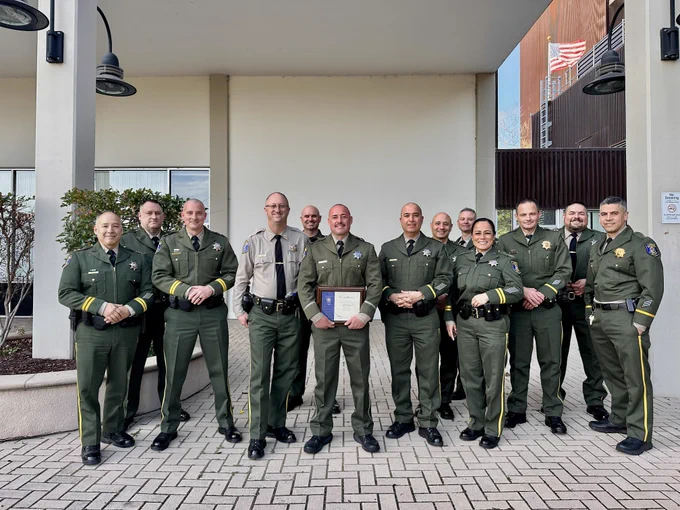 Command Staff and Deputy Navarro pose for a picture.