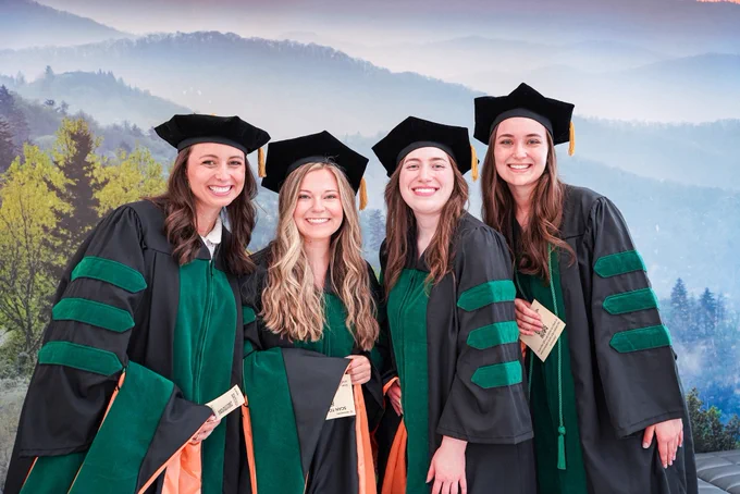 Group photo of graduates smiling