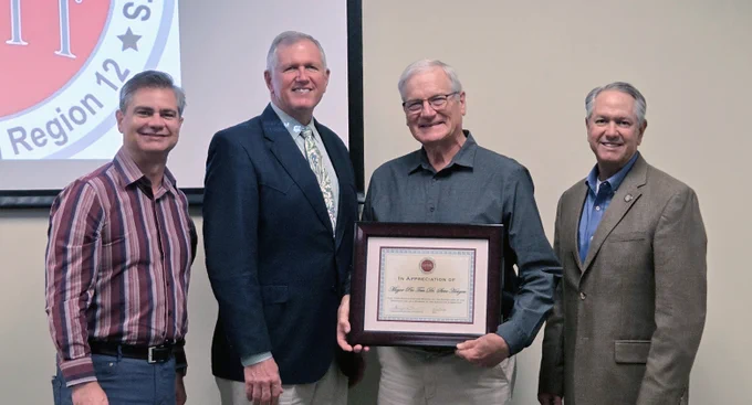 Former Granite Shoals Mayor Pro Tem Dr. Steve Hougen poses with a certificate for his services on the CAPCOG Executive Committee. Standing along side him is Pflugerville Mayor Doug Weiss, Burnet County Judge Bryan Wilson and Burnet County Commissioner Joe Don Dockery.