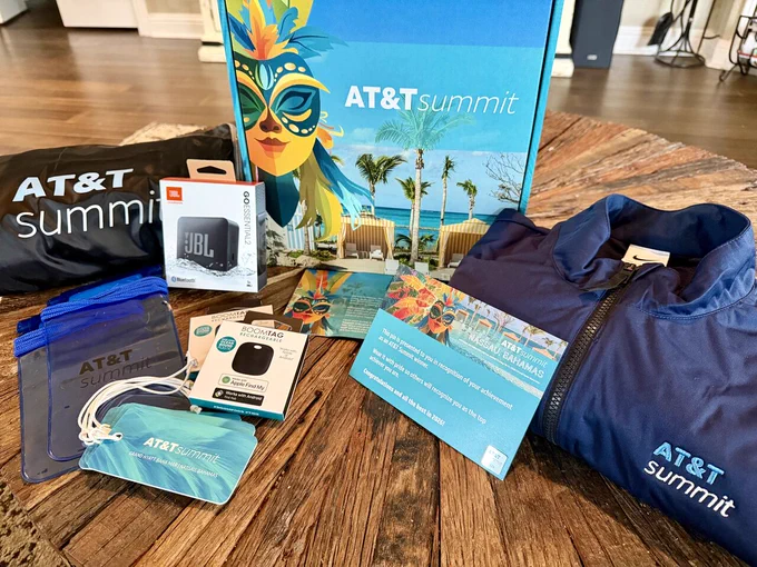 Summit care package with note of thanks and congratulations and various prizes and branded apparel