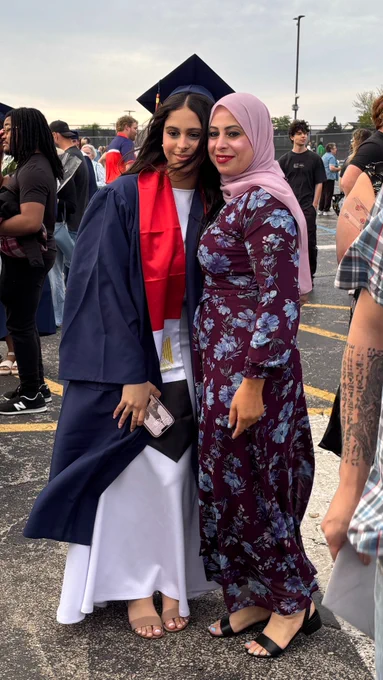 All smiles with diploma in hand after Stagg graduation.