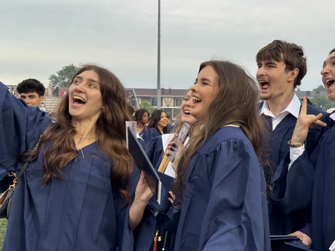 Chargers take a selfie after Stagg's commencement.