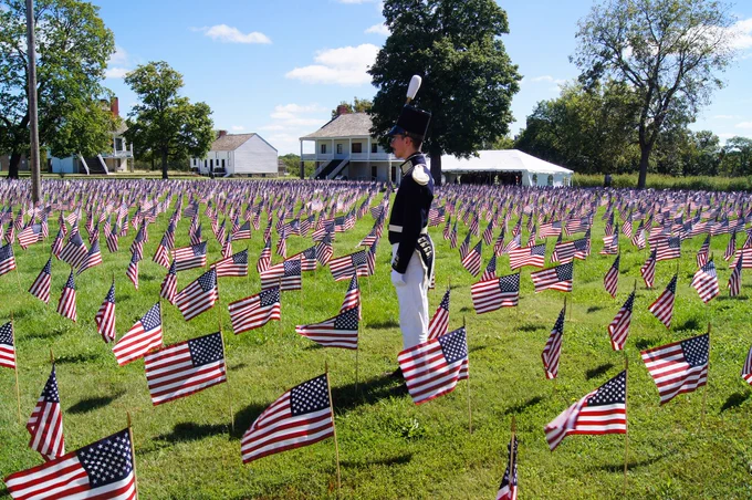 US flags create a field of honor at a Memorial Day remembrance event  at Fort Scott National Historic Site in Kansas.