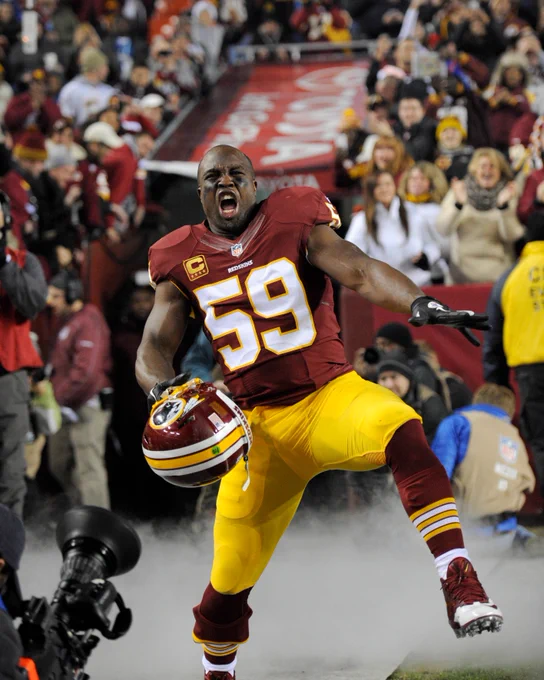 Photo of London Fletcher running out of the tunnel before a game.