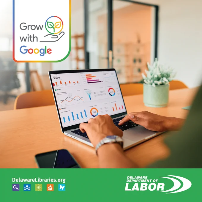 Person analyzing colorful business charts and graphs on a laptop in a modern office setting.