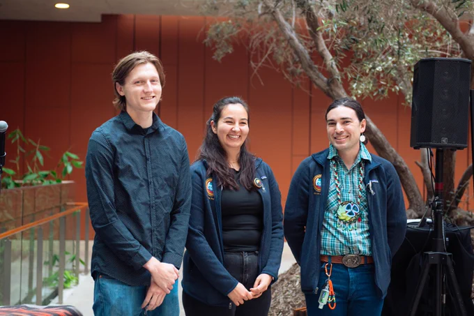 Three third-year medical students pose with their PRIME-TIDE jackets.