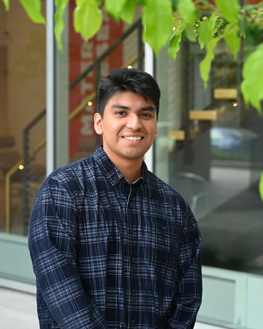 Boise State environmental science alum Josue Duran smiling for a portrait.
