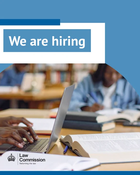 A zoomed in photo of two people working in a library using laptops and books. There is overlayed text that says ''We are hiring"