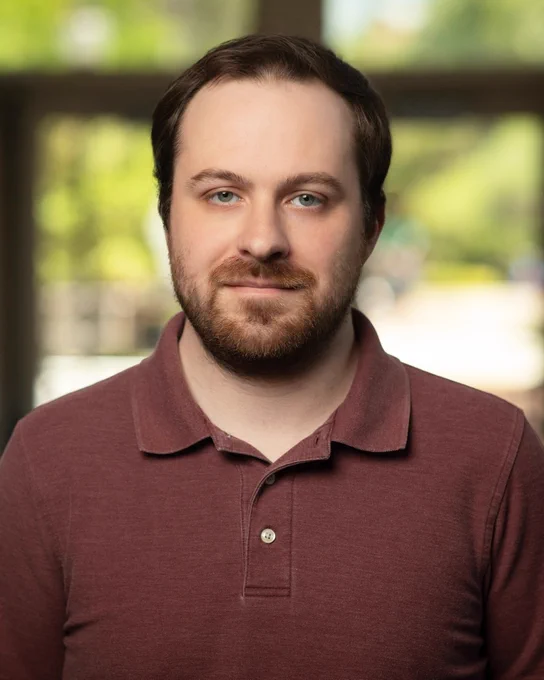 Headshot photo of Zackary Firestone.