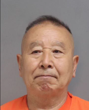 A booking photo of Enli Feng, 72 of San Bruno 