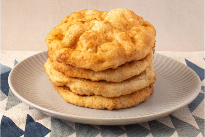 Fresh fry bread, a pan-Indigenous staple. (Photo courtesy of The Modern Navajo Kitchen, by Alana Yazzie/Diné)