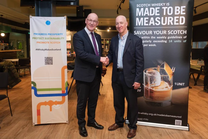 Scotland's First Minister John Swinney MSP shaking hands with Scotch Whisky Association Chief Executive Mark Kent.