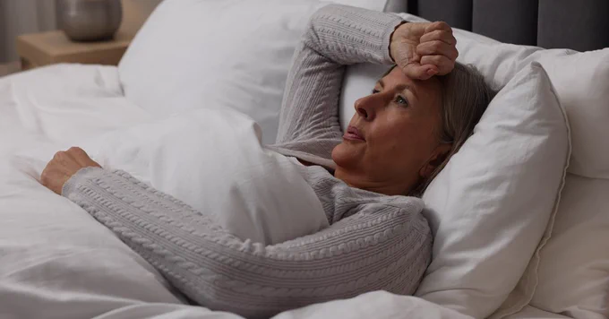 Improving sleep could become a target for future Alzheimer’s prevention strategies, particularly for women at elevated genetic risk. Photo Credit: iStock/Liudmila Chernetska