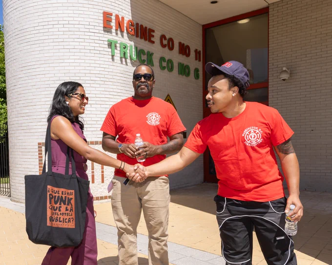 Photo of Aparna shaking the hand of a canvasser from IAFF 36