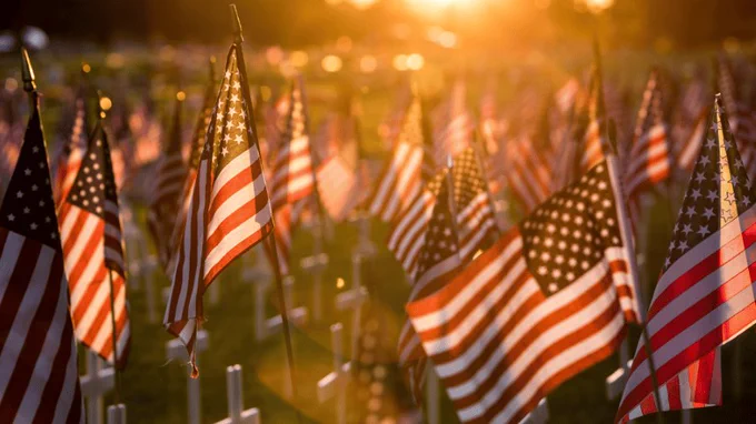 American flags at a national cemetery in honor of Memorial Day