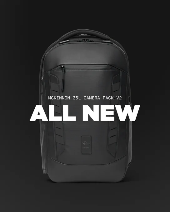 lack McKinnon 35L Camera Pack V2 launch image featuring Peter McKinnon signature and NOMATIC logo—the best camera backpack for professional photographers.