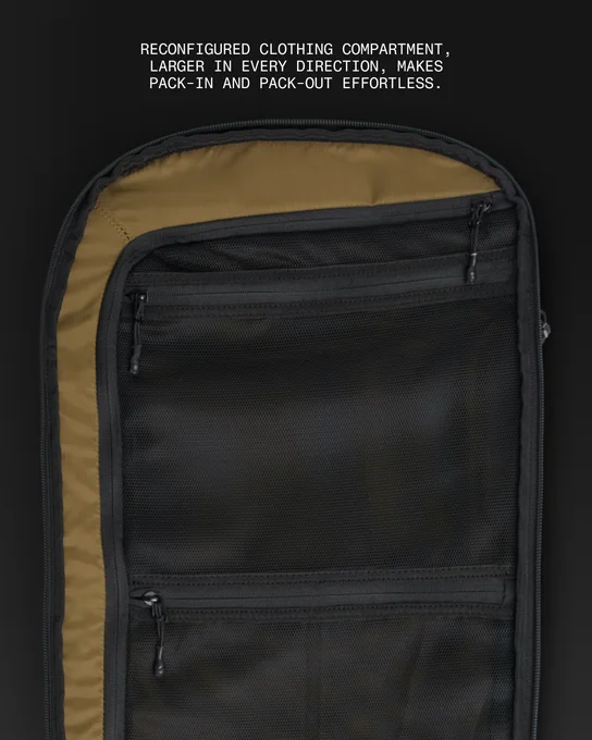 Interior view of the reconfigured and expanded clothing compartment in the NOMATIC McKinnon 35L V2 camera bag, showing mesh organization pockets.