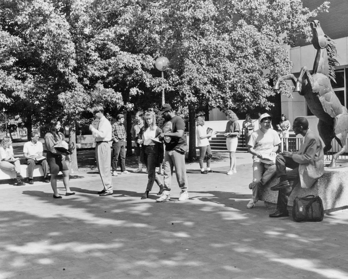 Boise State students from the 90s hanging out during passing period in front of Riverfront Hall. 
