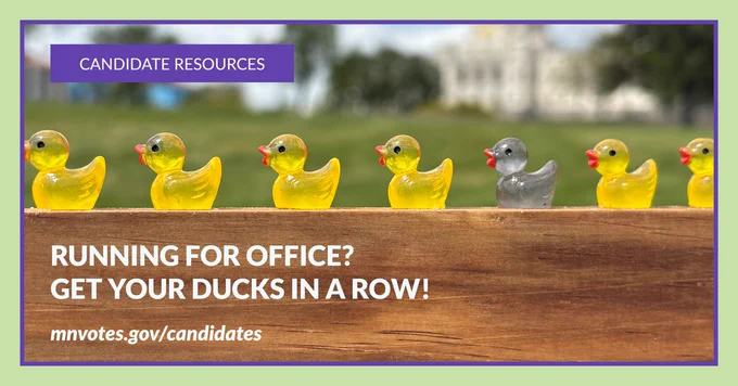 Photo of a row of small toy ducks on a wooden board. All are yellow except for one gray duck. In the background is the Minnesota State Capitol. Header says "CANDIDATE RESOURCES" in a purple banner. Below the ducks are the words "Running for office? Get your ducks in a row! mnvotes.gov/candidates"