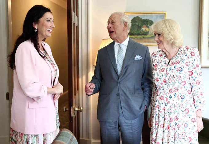 Image of three people standing - deputy First Minister Emma Little-Pengelly, King Charles III and Queen Camilla.