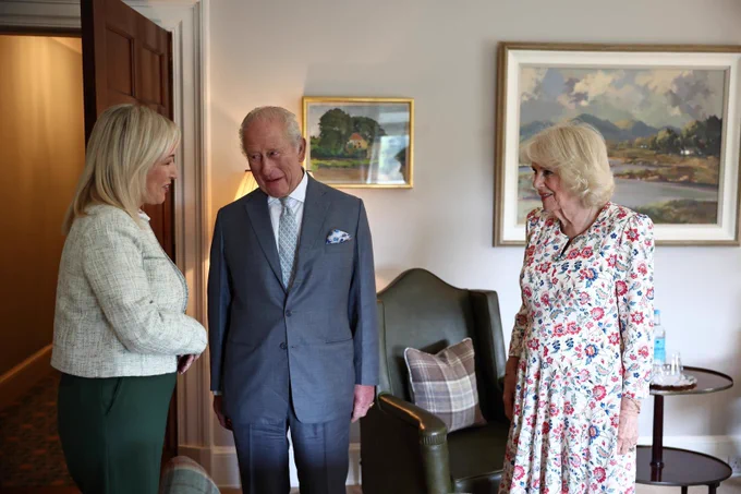 Image of three people standing - First Minister Michelle O’Neill, King Charles III and Queen Camilla.