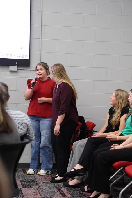 NHS Officer speaking into a microphone