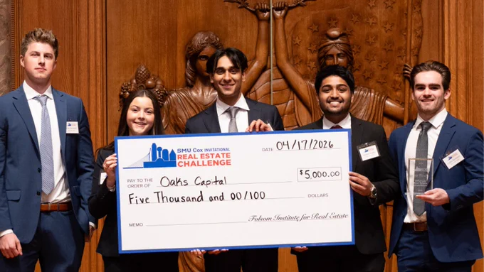 The first place SMU Cox School of Business B.B.A. student team hold a giant check at the inaugural Folsom Institute for Real Estate Pitch Competition.