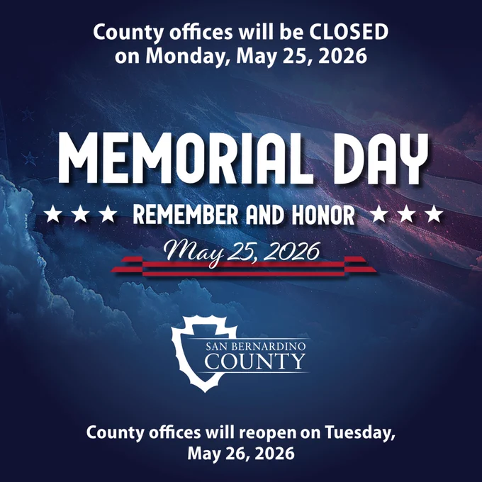 The image announces that San Bernardino County offices will be closed on Memorial Day, May 25, 2026, and will reopen on Tuesday, May 26, 2026. A background with clouds and a U.S. flag is visible. 