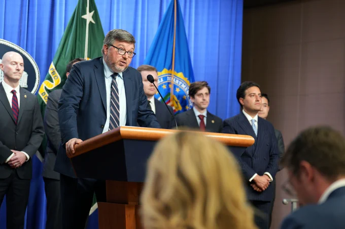 Associate Attorney General Stanley Woodward delivers remarks during a press conference.