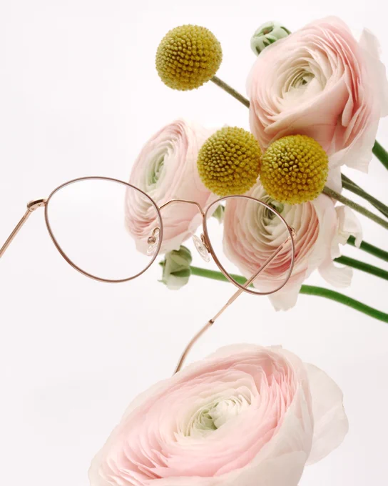 Andy Wolf glasses against flowers