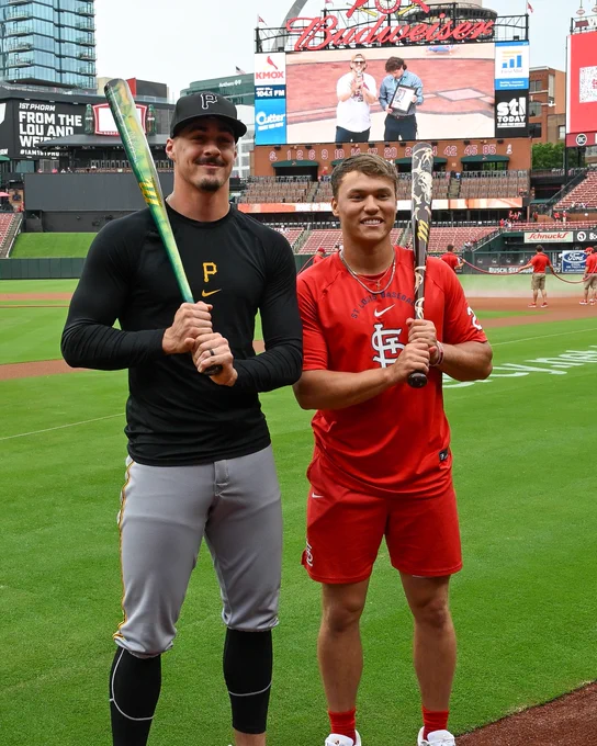 Konnor Griffin and JJ Wetherholt pose for a photo at Busch Stadium on Tuesday. Each holds a baseball bat they gifted one another.