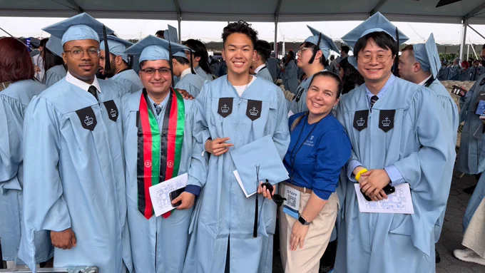 a group of students in commencement regalia