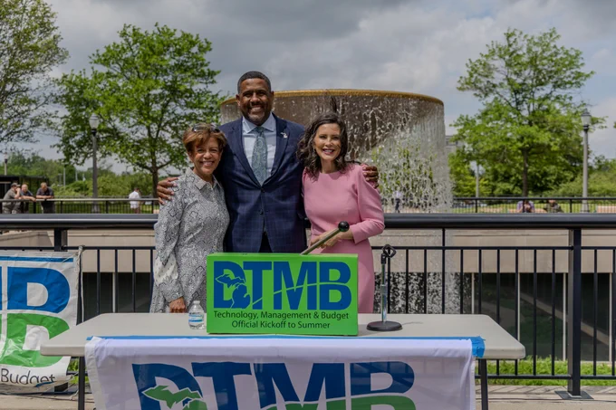 Dr. Sue Carnell, chief deputy superintendent for the Michigan Department of Education, DTMB Acting Director Kyle Guerrant and Gov. Whitmer posing in front of the Brian J. Whiston Memorial Fountain.