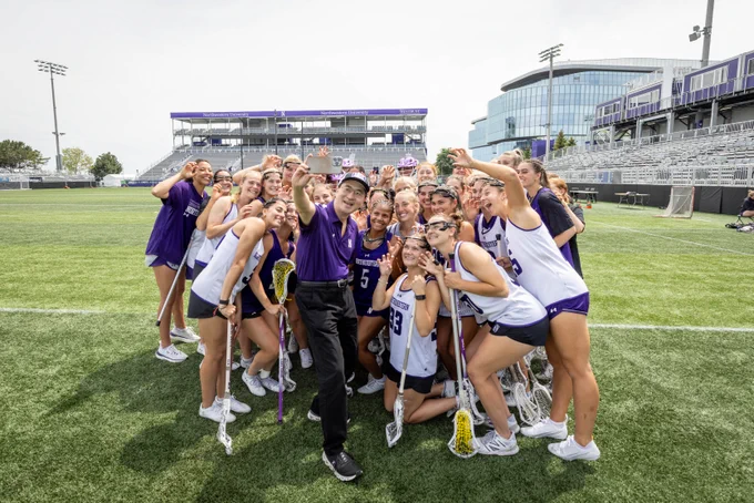 President-elect Mung Chiang stops by a Lacrosse practice and poses with them for a selfie. 