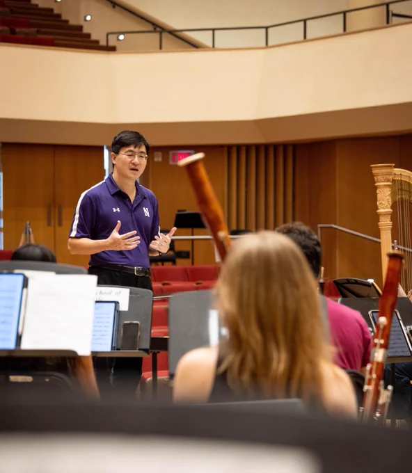 President-elect Mung Chiang chats with members of Northwestern Symphony Orchestra. 
