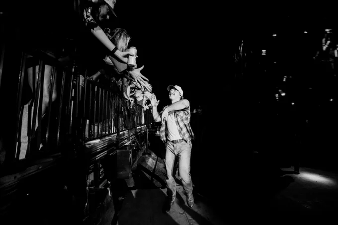 Morgan Wallen photo at concert high-fiving fans