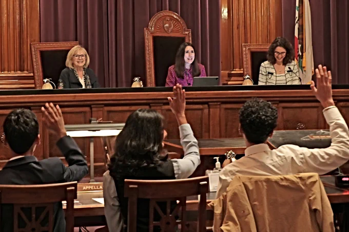 Chief Justice Patricia Guerrero and Power of Democracy leads with students in courtroom