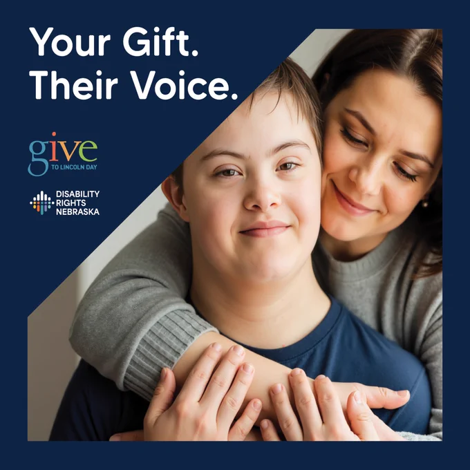 Graphic with the text “Your Gift. Their Voice.” alongside the Give to Lincoln Day and Disability Rights Nebraska logos. The image shows a smiling young person with Down syndrome being hugged from behind by a woman, emphasizing support, empowerment, and advocacy for people with disabilities.