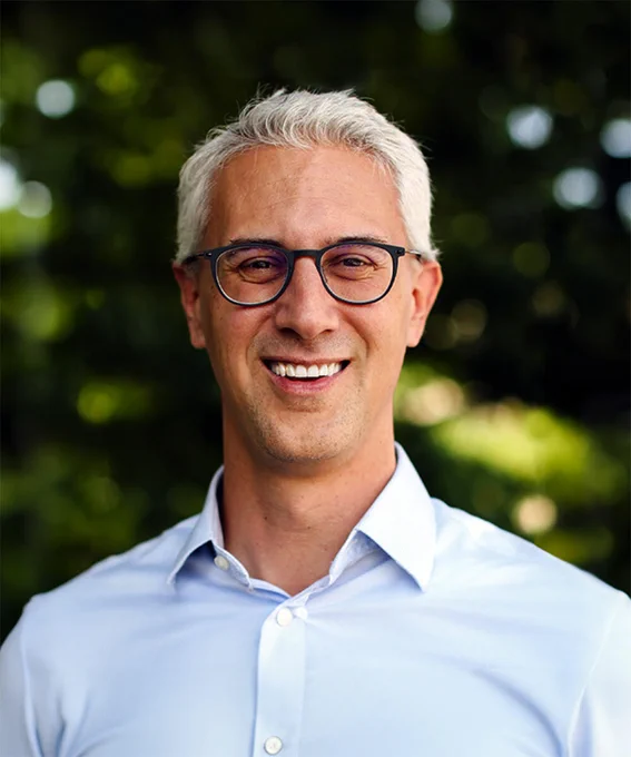 Headshot of Michael Ward, a man with light hair, wearing glasses and a collared shirt