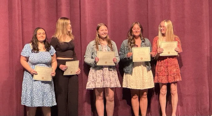 DCTC students on stage winning awards 